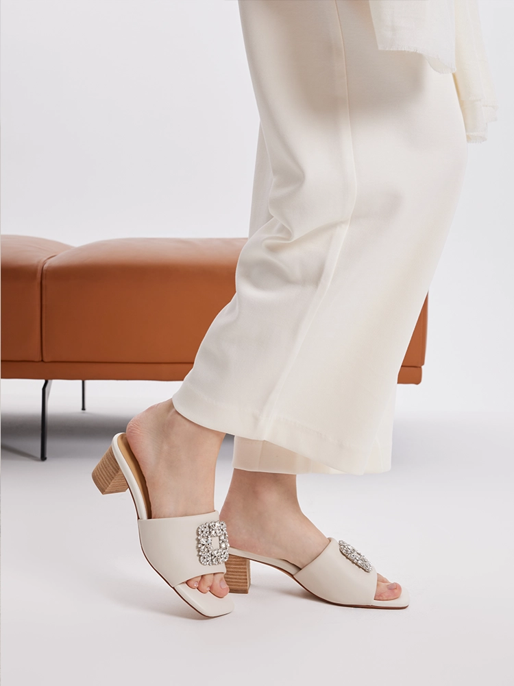 PAZZION, Florence Crystal Embellished Buckle Leather Sandal Heels, Beige