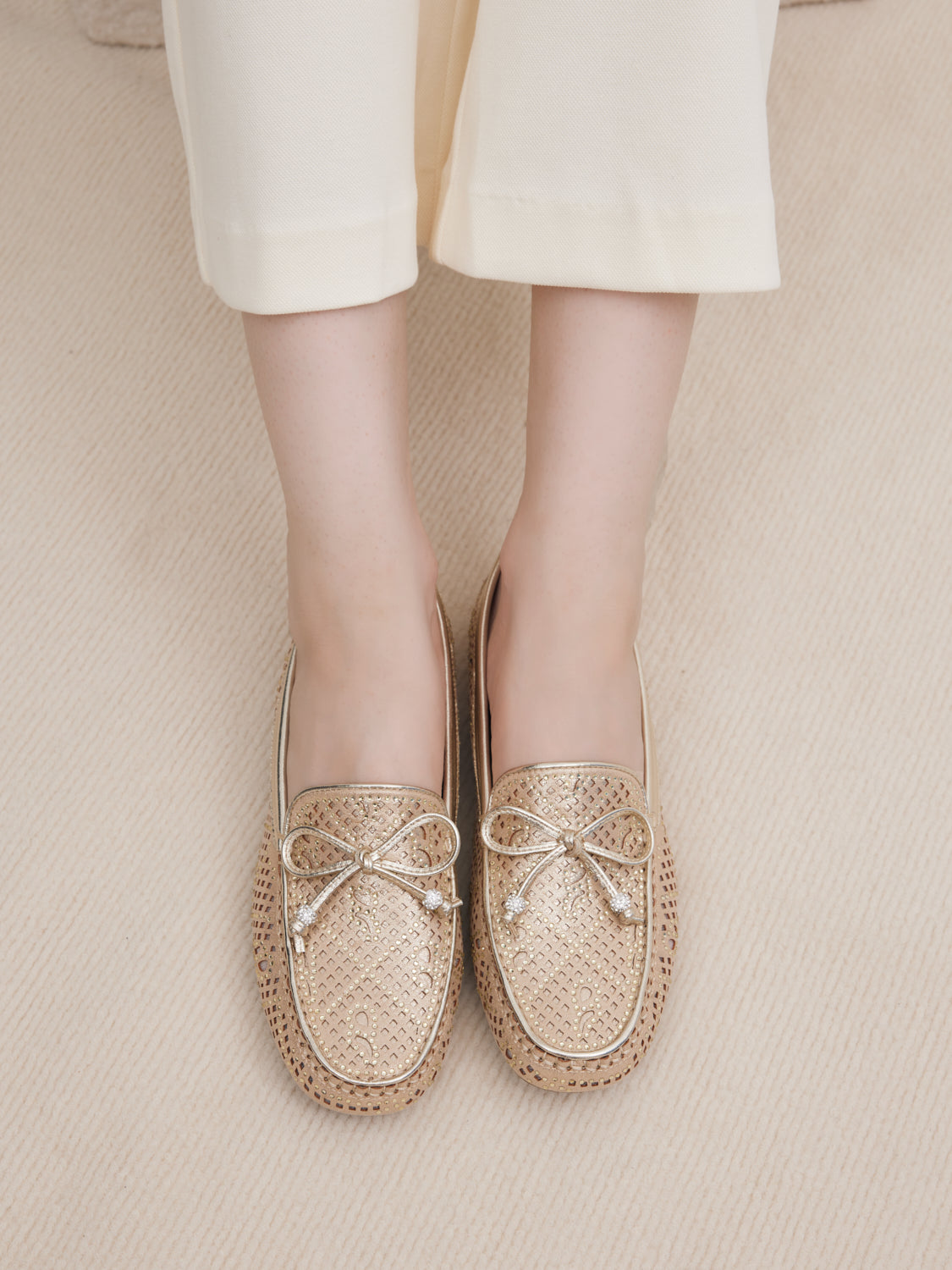 PAZZION, Rita Perforated Crystal Embellished Bow Moccasins - Gold, Gold